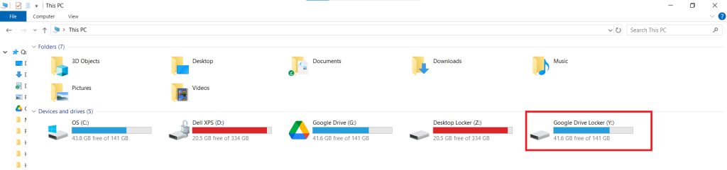 A screenshot of the Windows File Explorer "This PC" view after decrypting the Google Drive Locker, with a red box highlighting the now-visible "Google Drive Locker (Y:)" drive.