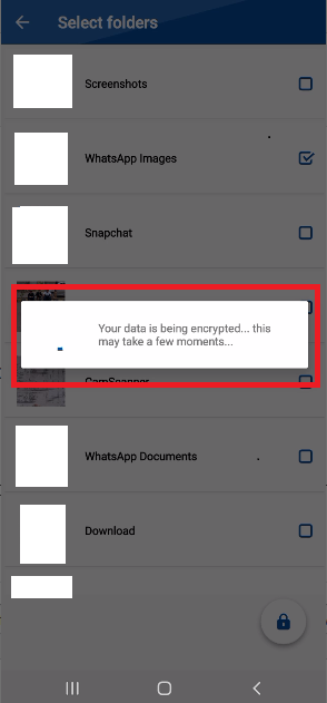 A screenshot from the Folder Lock mobile app's "Select folders" screen, showing a pop-up window. A red box highlights a loading indicator with the message "Your data is being encrypted... this may take a few moments," indicating that the selected files are currently being secured.